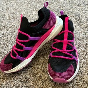 Black, hot pink and purple no tie tennis shoe.